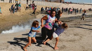 Hundreds of migrants try to storm US border [upl. by Alimhaj]